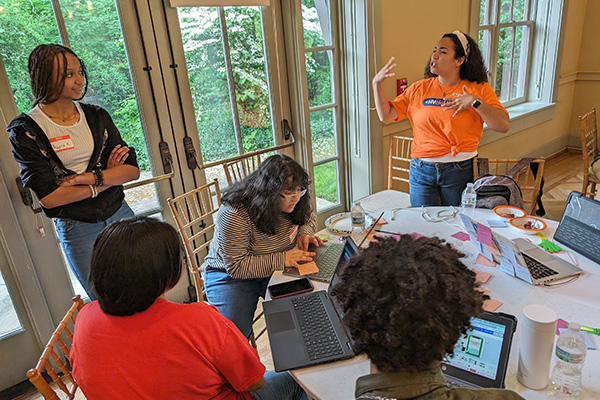 Lively team discussion at the HV Digital Rally Hackathon
